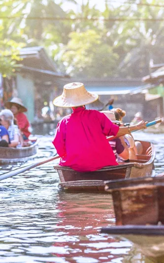 Traditional floating market on Bangkok's canals in Thailand - Contiki Bangkok to Luang Prabang Tour