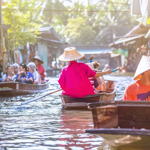 Traditional floating market on Bangkok's canals in Thailand - Contiki Bangkok to Luang Prabang Tour