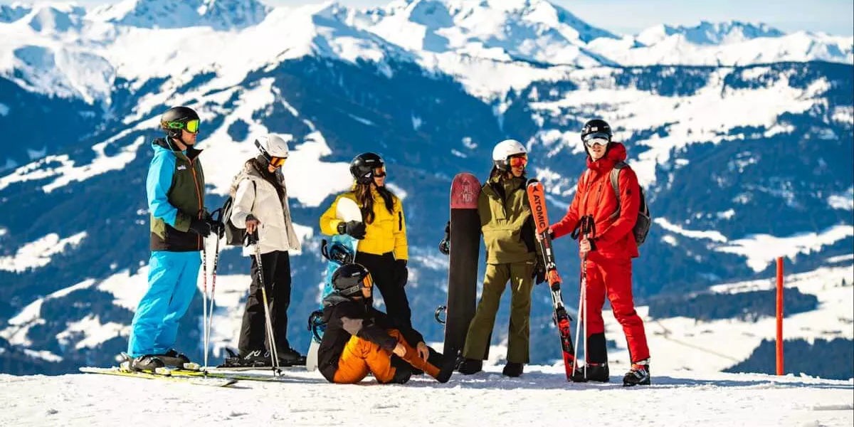 group of skiers talking on the mountain