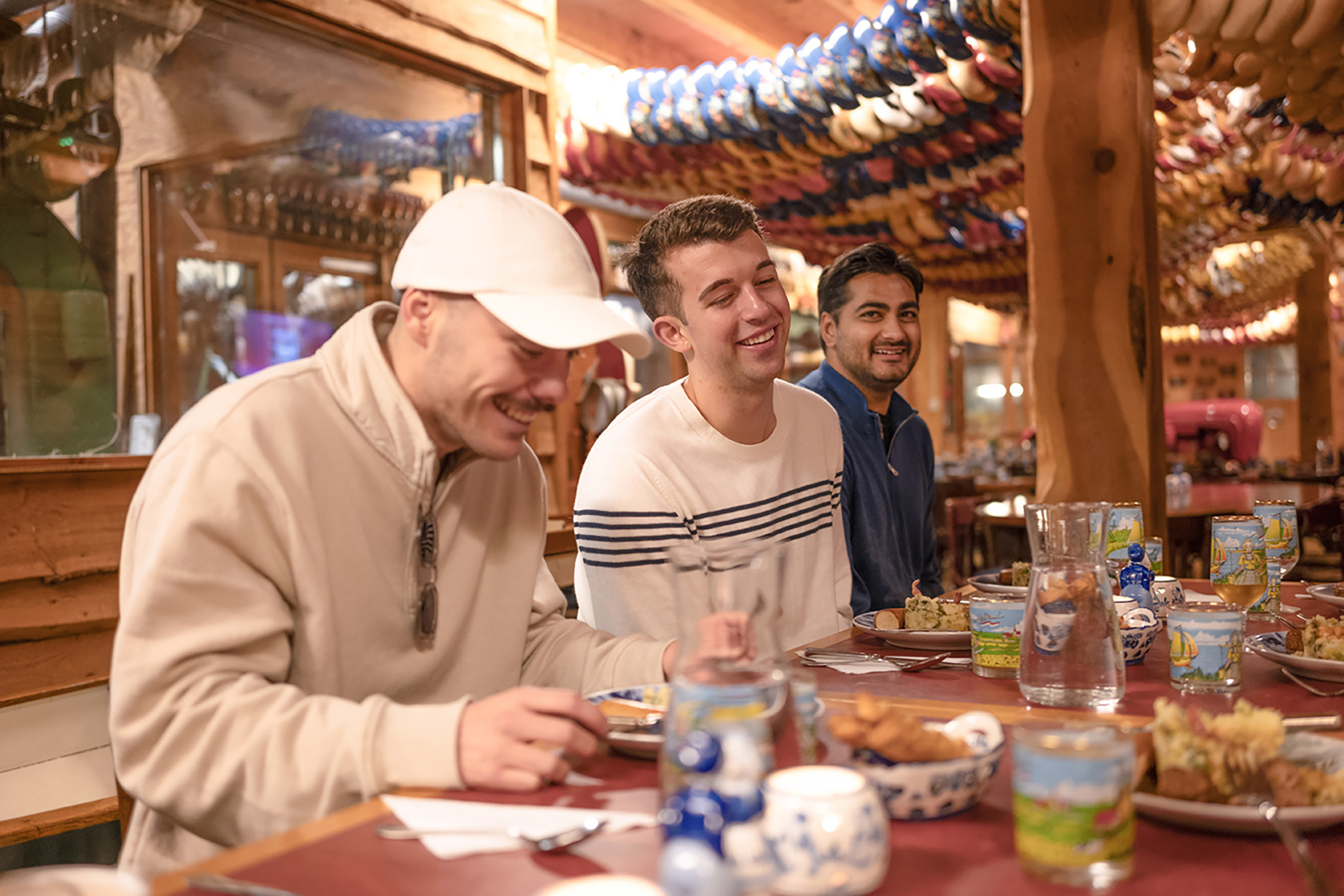 Travellers enjoying a traditional Dutch dinner in Amsterdam, Netherlands