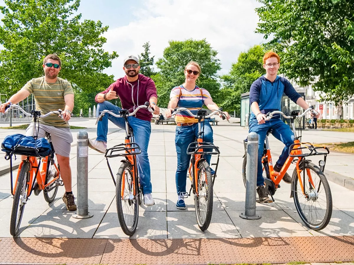 Young people riding bikes in Denmark.