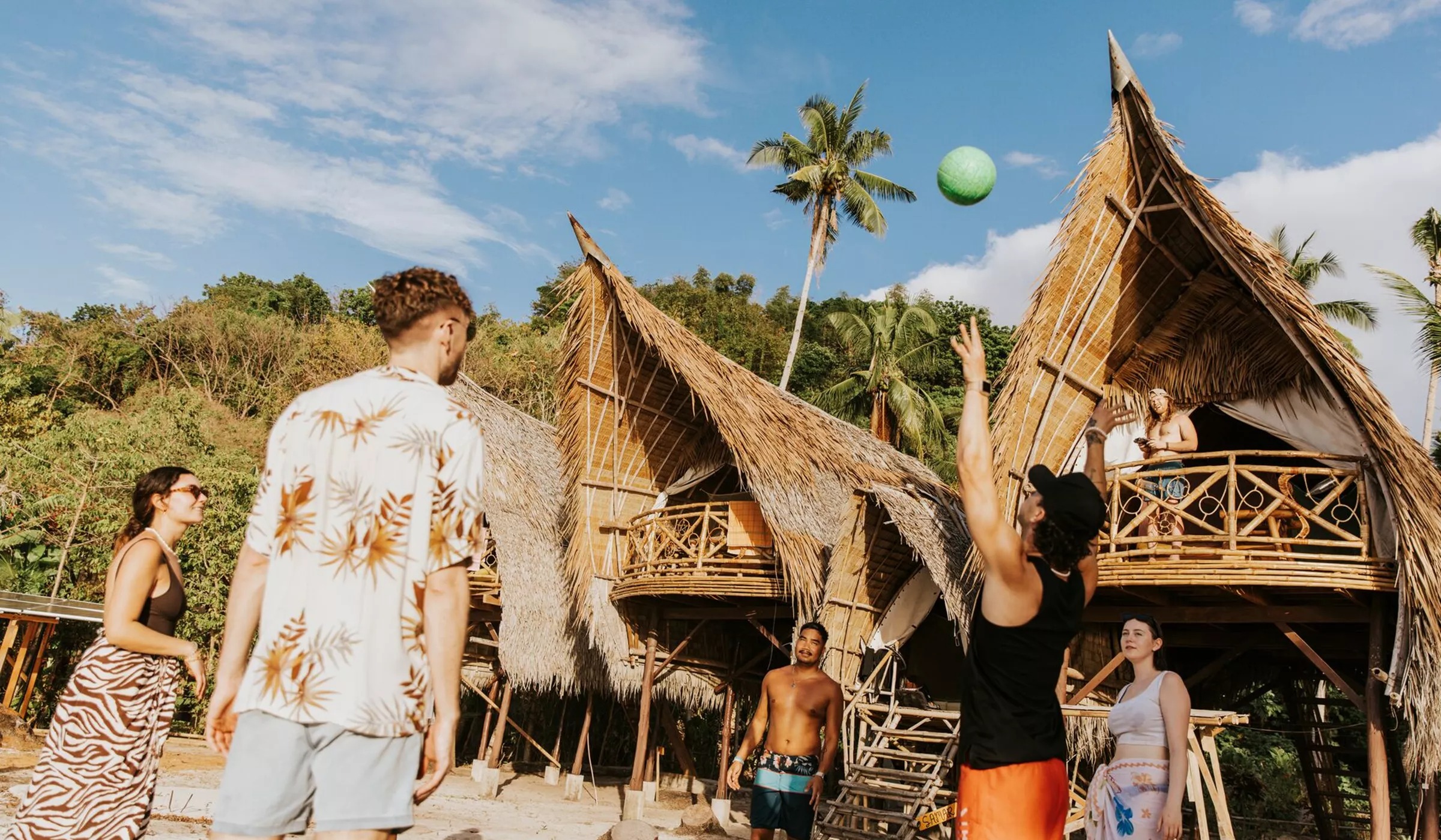 Isla Experiences Group Playing Volleyball On Beach Philippines