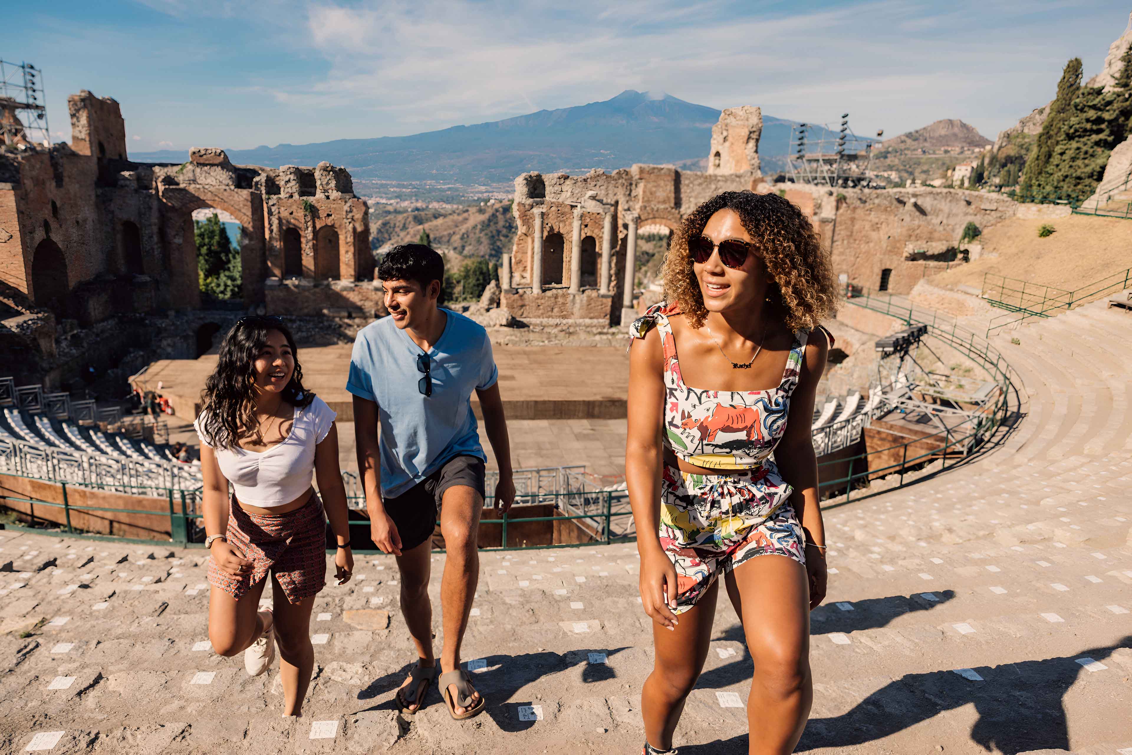 Young Group Of Travelers Exploring Ancient Sicily