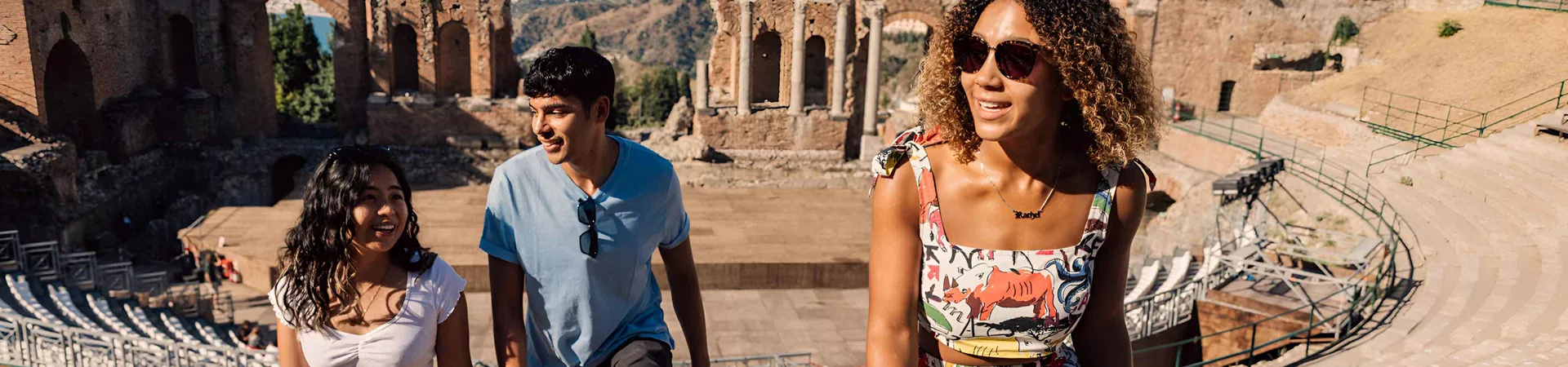 Young Group Of Travelers Exploring Ancient Sicily