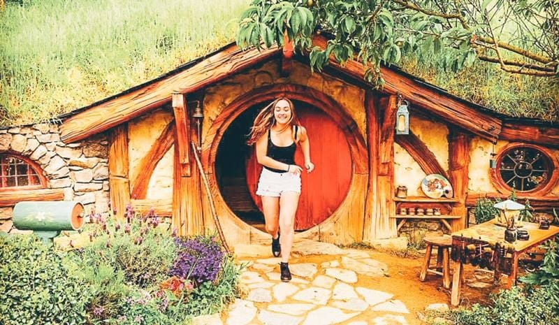 A girl running out of the hobbit house