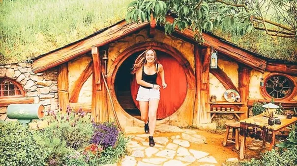 A girl running out of the hobbit house