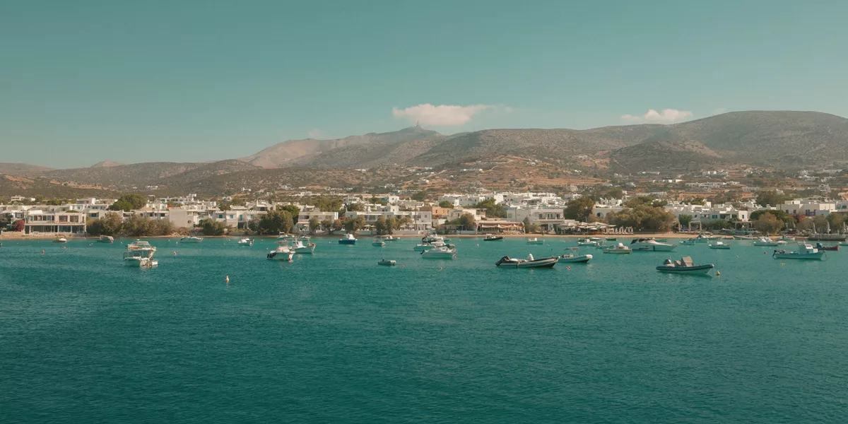 Boats anchored off the coast of Paros, Greece - Contiki's Best of Greece with Island Hopping Tour