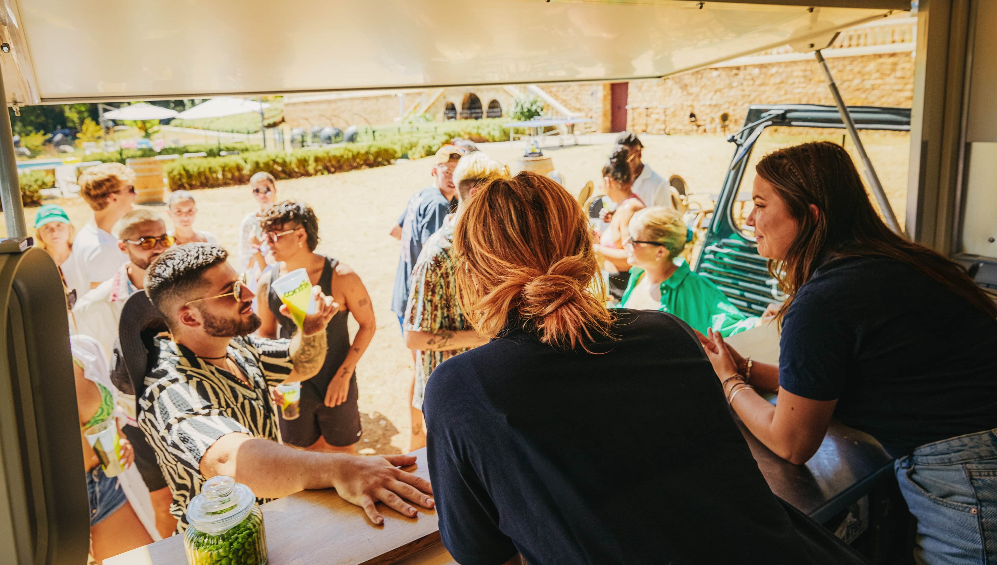 Team Members Serving Drinks To Travellers Chateau Bar France