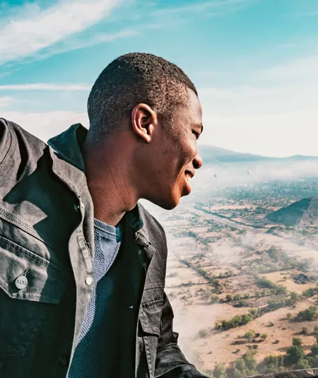 A man enjoying a hot air balloon flight over the Pyramids of Teotihuacán on Contiki's Mexican Fiesta Tour