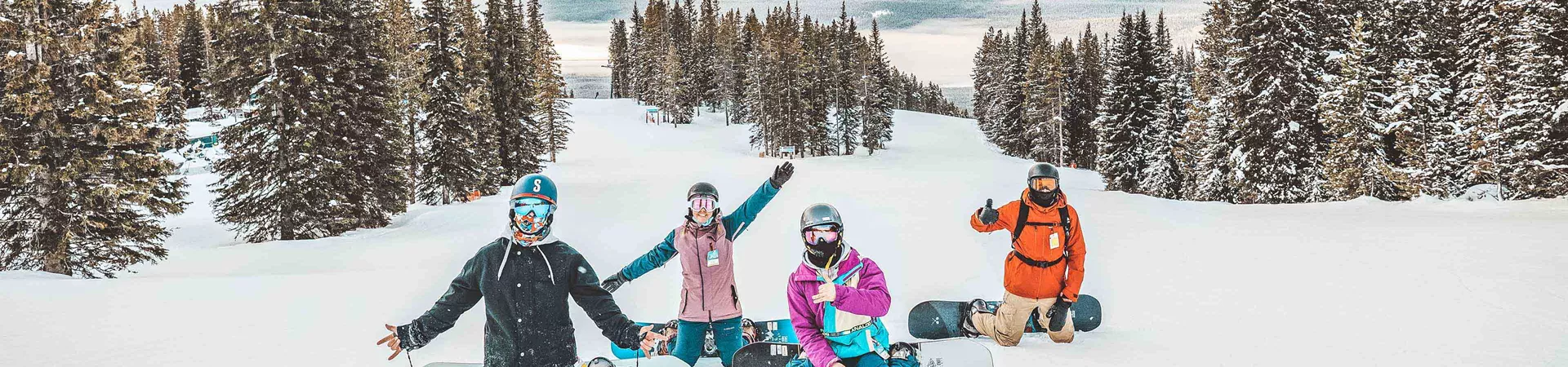 Group Of Snowboarders In Snowy Mountains 0003Amer2020