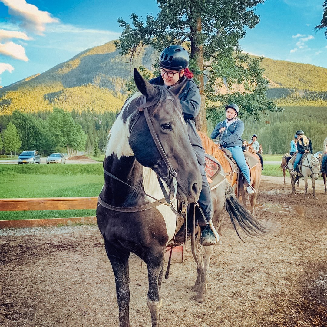 Travellers horseback riding in Banff, Canada