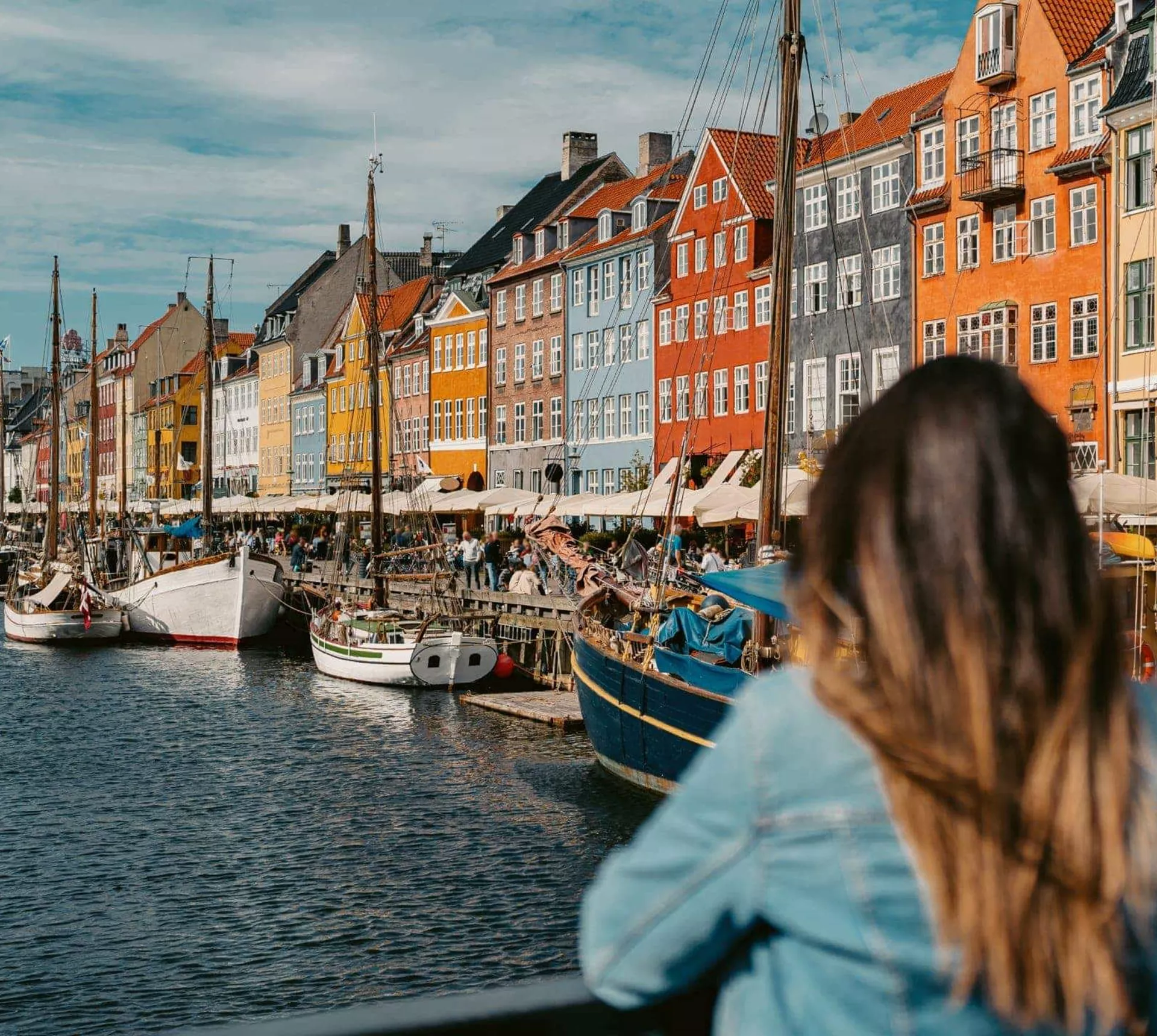 Two girls overlooking Nyhavn harbour in Copenhagen, Denmark - Contiki Best of Scandinavia Tour