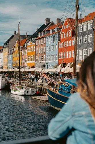 Two girls overlooking Nyhavn harbour in Copenhagen, Denmark - Contiki Best of Scandinavia Tour