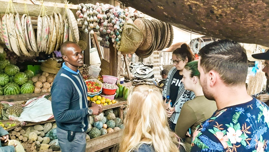 Travellers with a local guide at African Galleria at Ngorogoro Crater in Tanzania