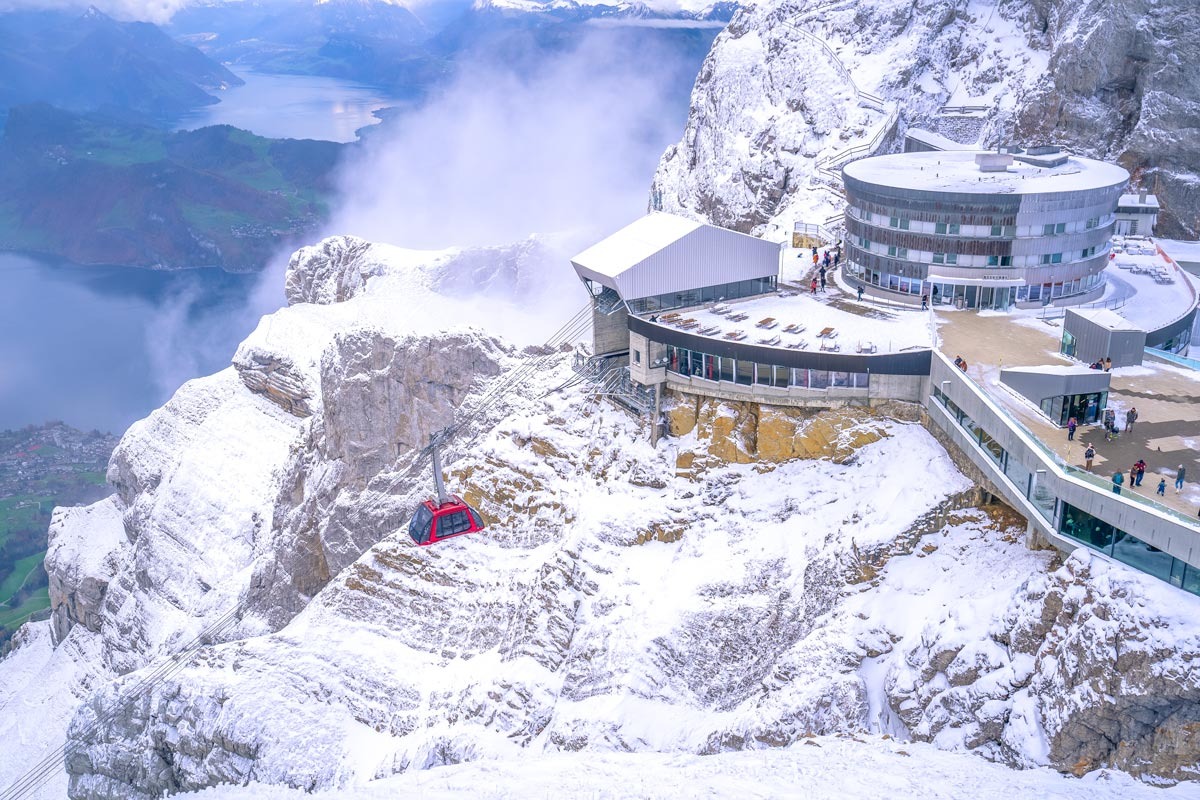 Building At The Top Of A Mountain Covered By Snow in Switzerland.