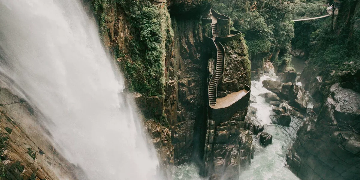 The cascading Pailón del Diablo waterfall flows through a lush canyon on the Contiki Best of Ecuador & Galapagos Islands Tour