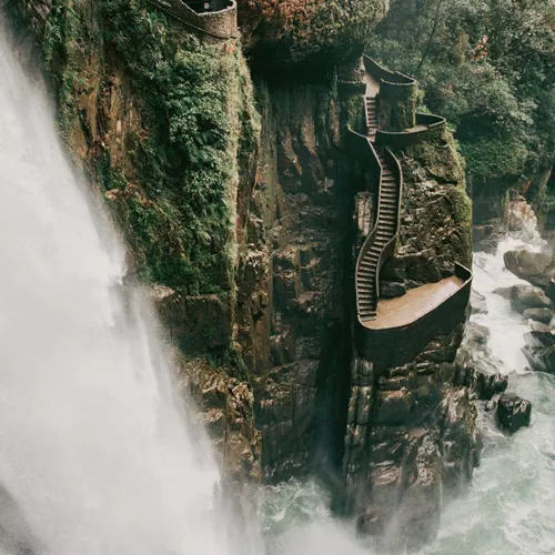 The cascading Pailón del Diablo waterfall flows through a lush canyon on the Contiki Best of Ecuador & Galapagos Islands Tour