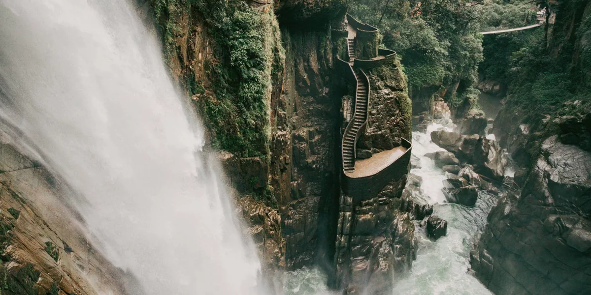 The cascading Pailón del Diablo waterfall flows through a lush canyon on the Contiki Best of Ecuador & Galapagos Islands Tour