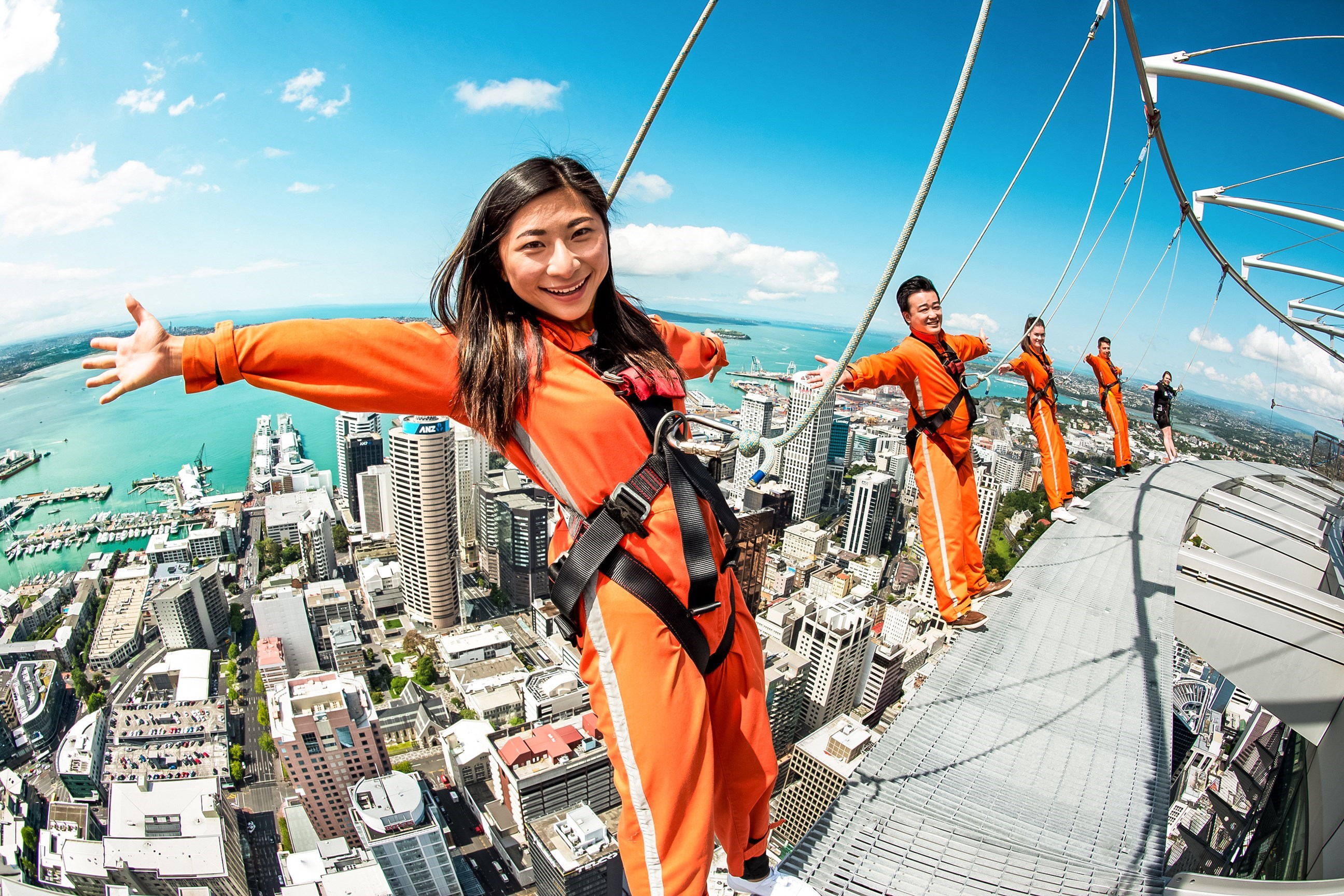 Travellers standing on the edge of the circular platform at Sky Tower, Auckland, New Zealand