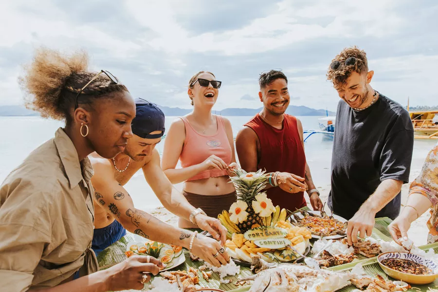 Travellers Waeting Dinner In Philippines On Beach