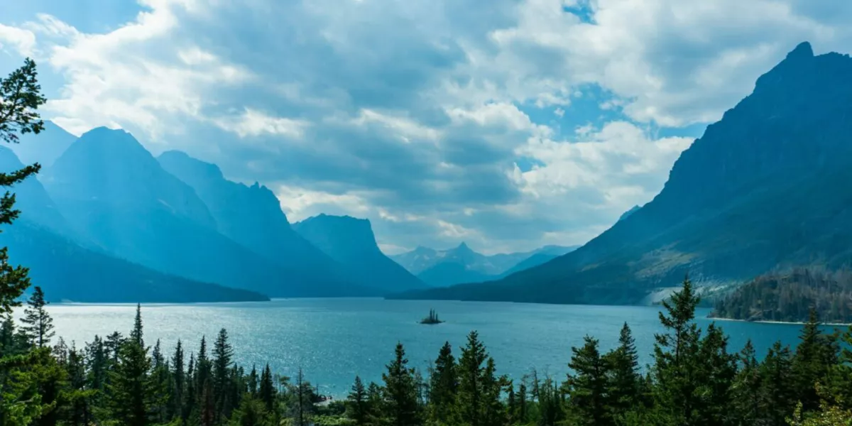 Lake With Mountains Wround Blue Cloudy Sky