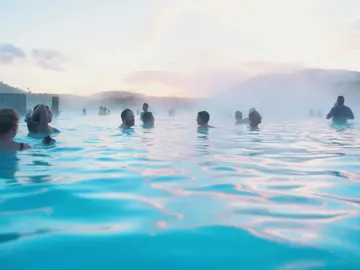 Contiki travellers bathing in the Blue Lagoon geothermal spa in Iceland - Contiki Best of Iceland Tour