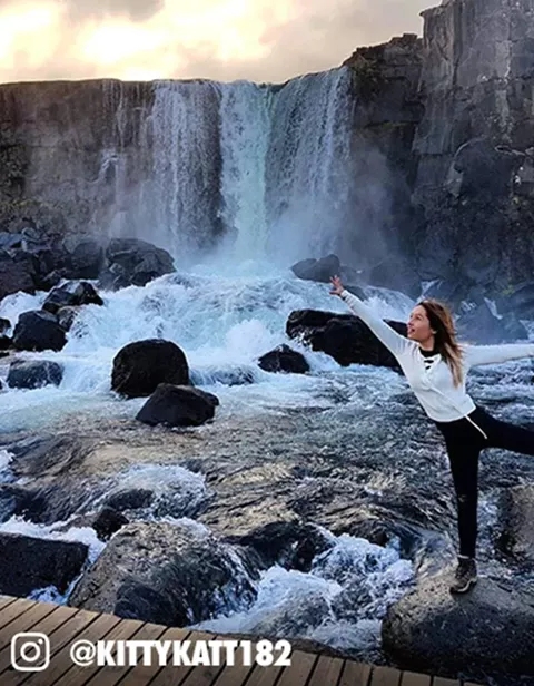 Traveller Next To Waterfall