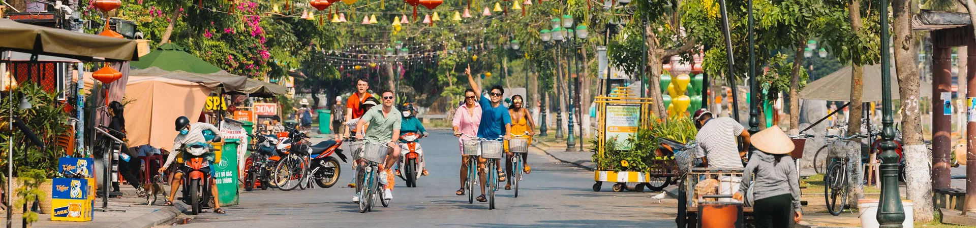 Group Youn Travellers Riding Bikes Through Thailand Cp