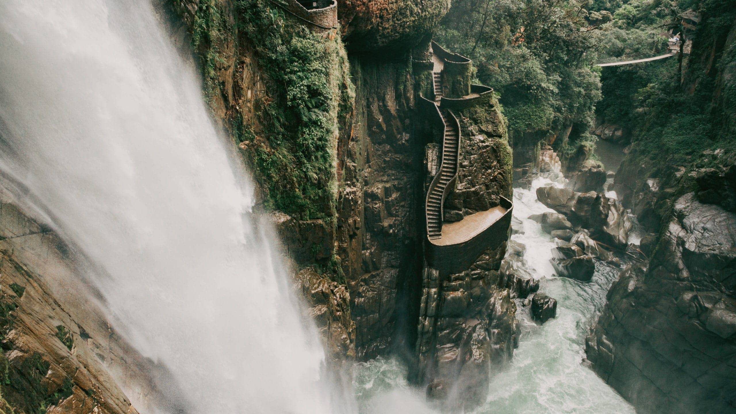 The cascading Pailón del Diablo waterfall flows through a lush canyon on the Contiki Best of Ecuador & Galapagos Islands Tour