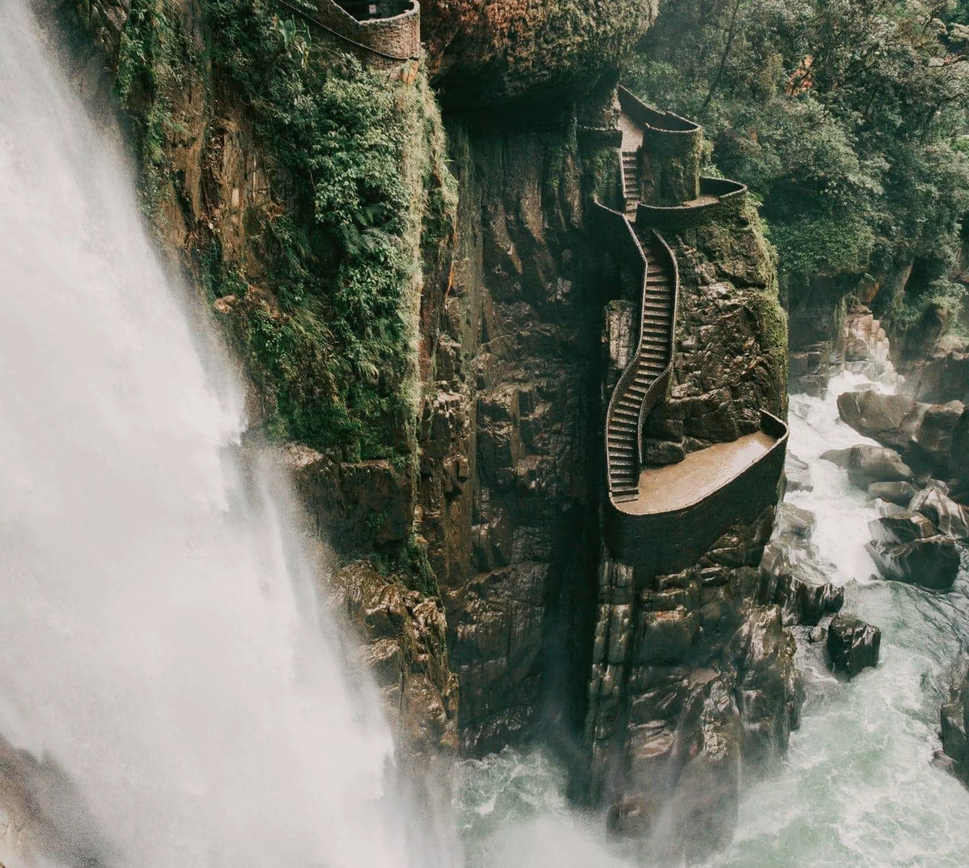 The cascading Pailón del Diablo waterfall flows through a lush canyon on the Contiki Best of Ecuador & Galapagos Islands Tour