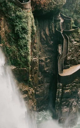 The cascading Pailón del Diablo waterfall flows through a lush canyon on the Contiki Best of Ecuador & Galapagos Islands Tour
