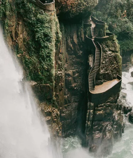 The cascading Pailón del Diablo waterfall flows through a lush canyon on the Contiki Best of Ecuador & Galapagos Islands Tour