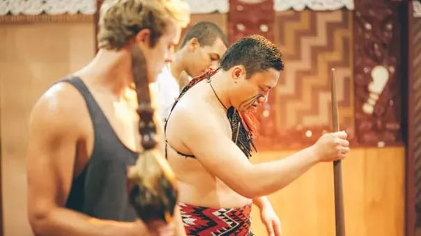 A tourist watching a local man during a ritual