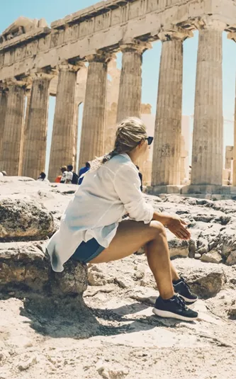 Contiki traveller admiring the Parthenon atop the Acropolis in Athens, Greece, on the Ultimate European Plus Egypt Tour