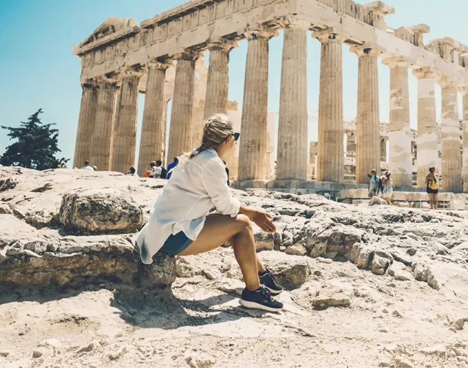 Contiki traveller admiring the Parthenon atop the Acropolis in Athens, Greece, on the Ultimate European Plus Egypt Tour