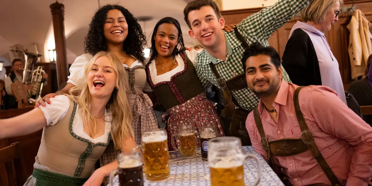 Friends Enjoying Beer And Smiling