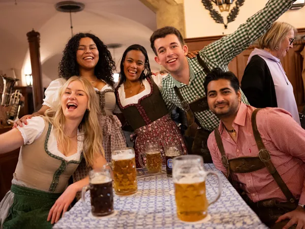 Friends Enjoying Beer And Smiling