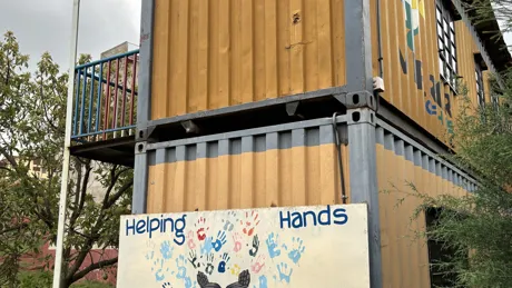 A tall building with a sign on the side of it