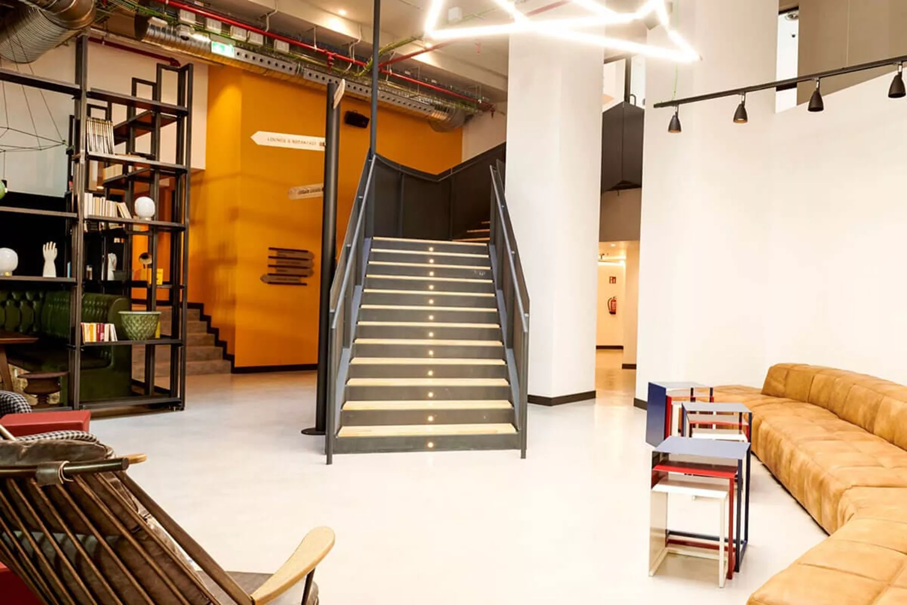 Generator Hostel hall with couches and staircase