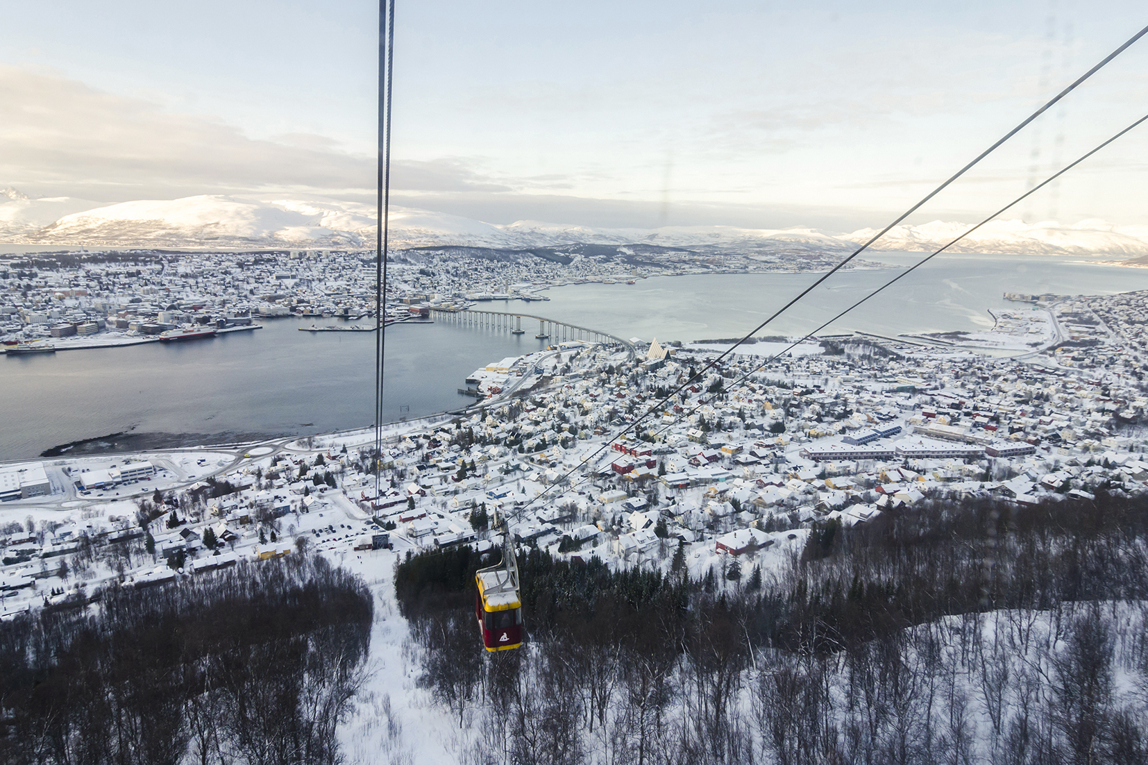 Cable car moves across the landscape of Tromso, in Norway