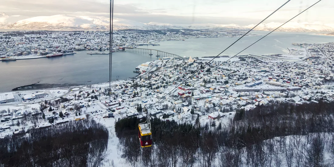 Cable car moves across the landscape of Tromso, in Norway