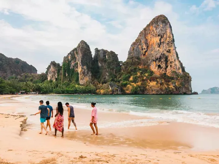Young People Walking On A Beach In Thailand