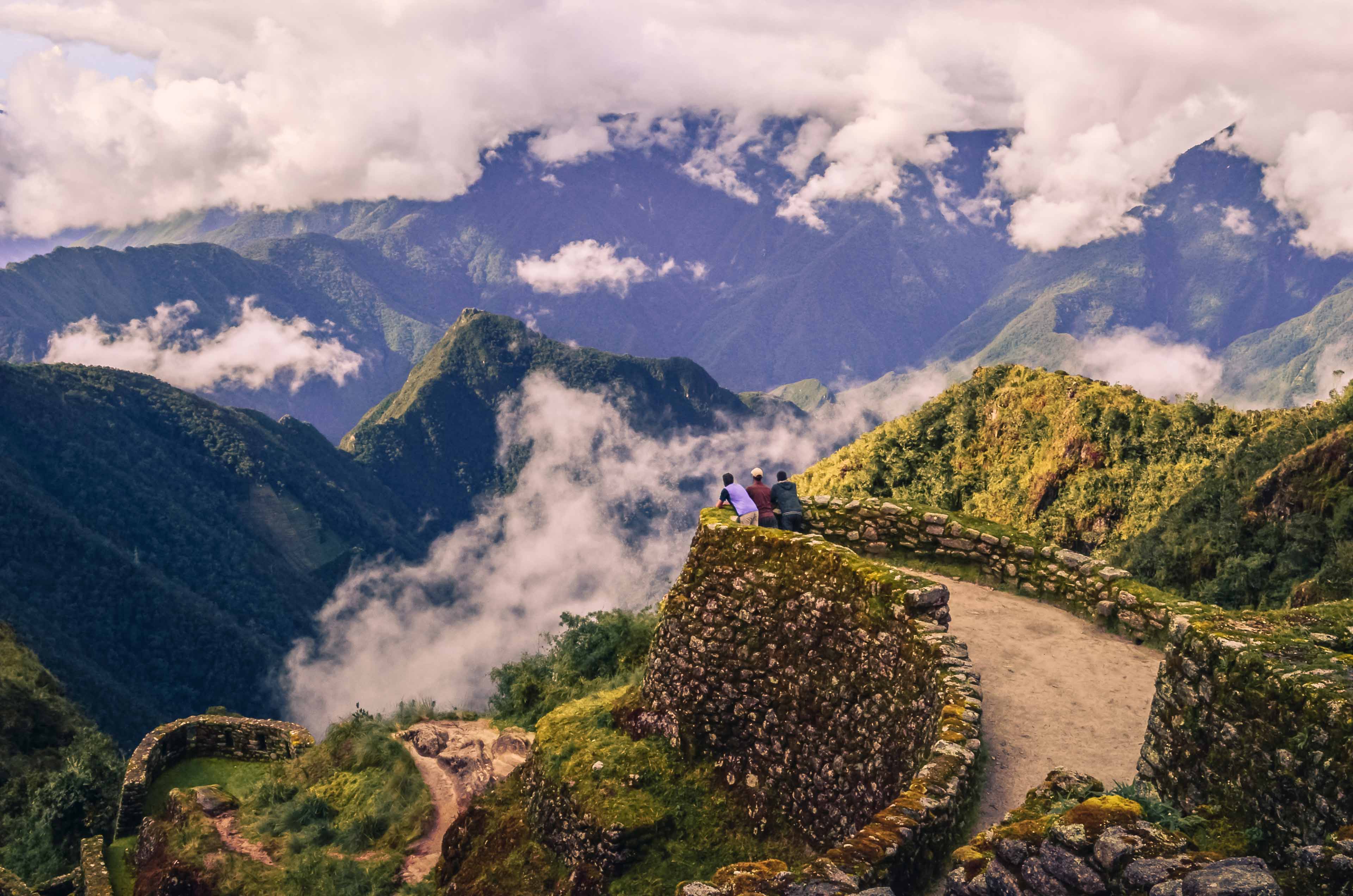 faq-banner-hikers-looking-at-the-sacred-valley-machu-picchu-peru.jpg