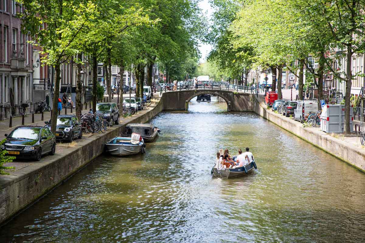 People In A Boats In Canal Sunny Day