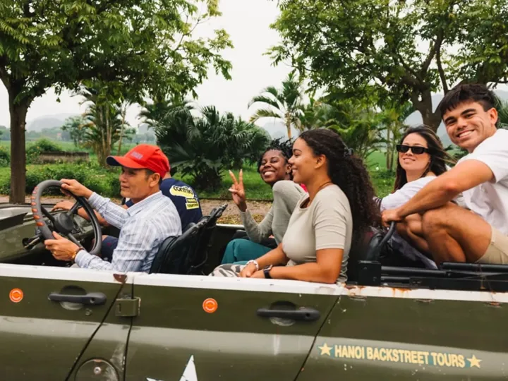 People in the car with tour guide