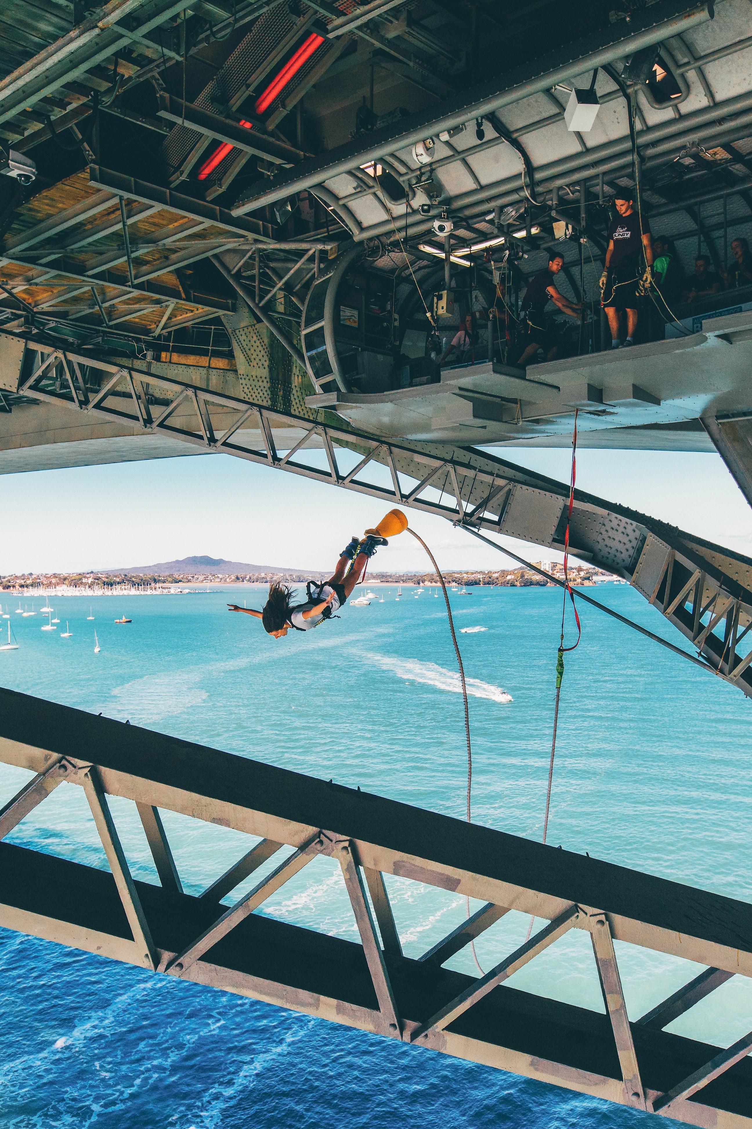 Traveller bungy jumping from the Harbour Bridge in Auckland, New Zealand
