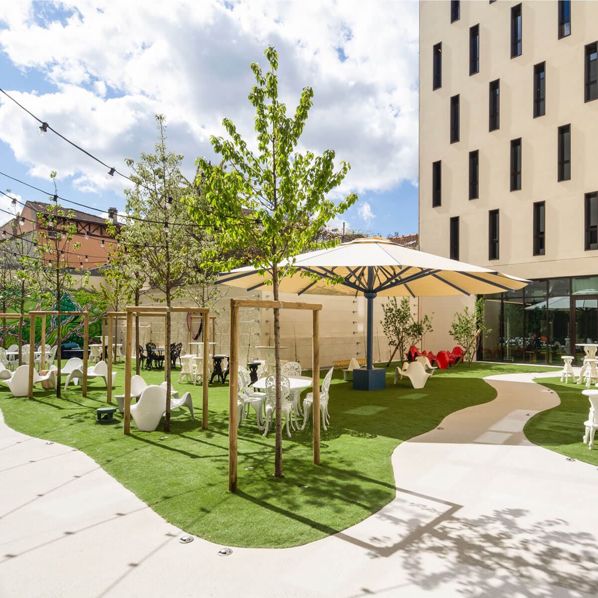 A  white umbrella in the garden