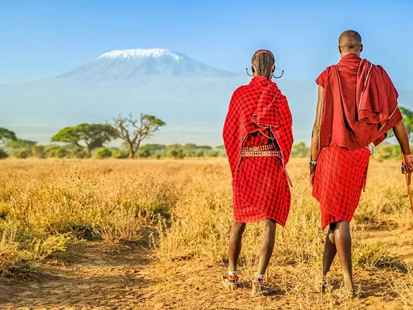 Warriors From Maasai Tribe Looking At Mount Kilimanjaro