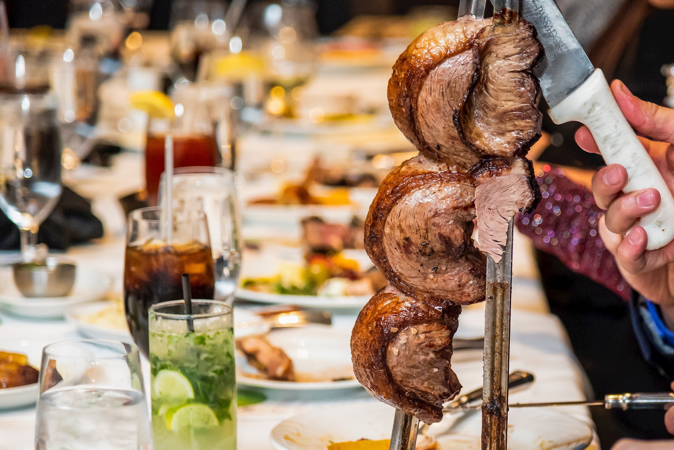 Traditional Churrascaria Barbecue Dinner Being Served, Rio De Janeiro, Brazil