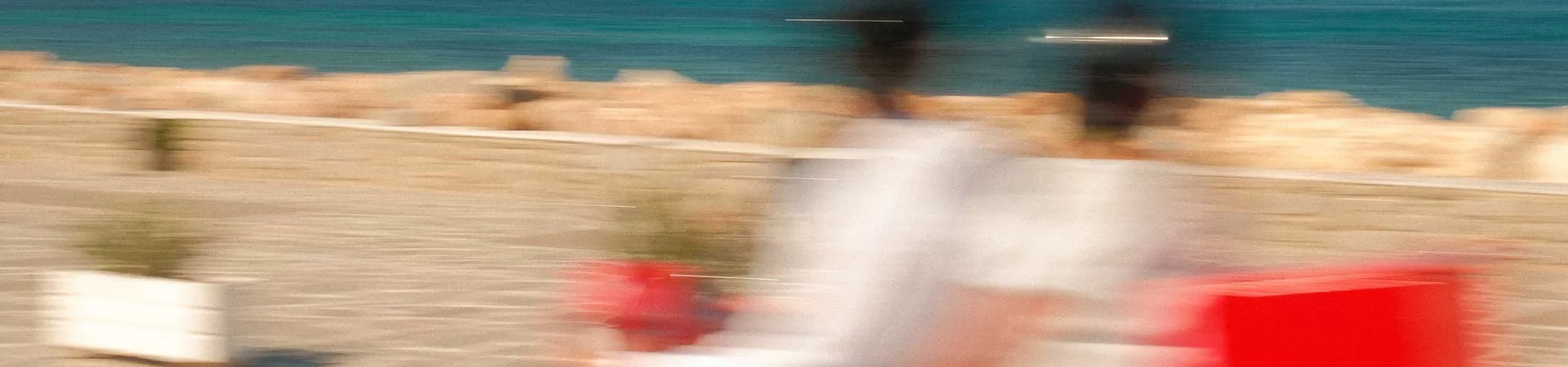 Blurred Motorbike Going Past Beach